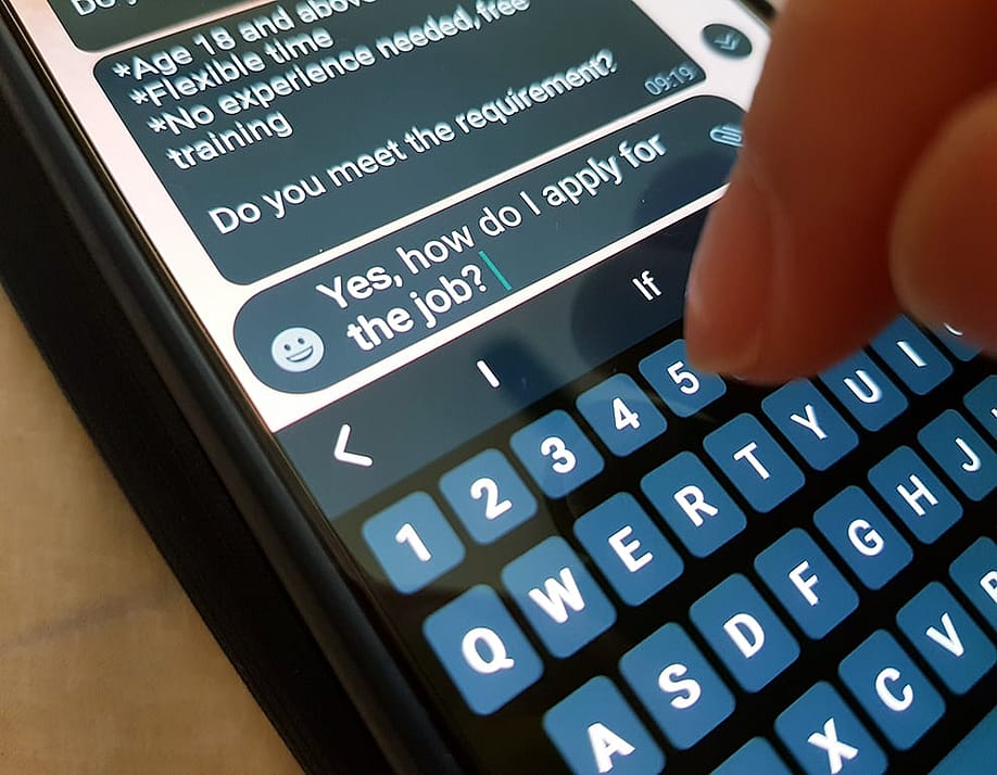A person asks how to apply as a response to a job offer via SMS. — Celia Ong // Shutterstock