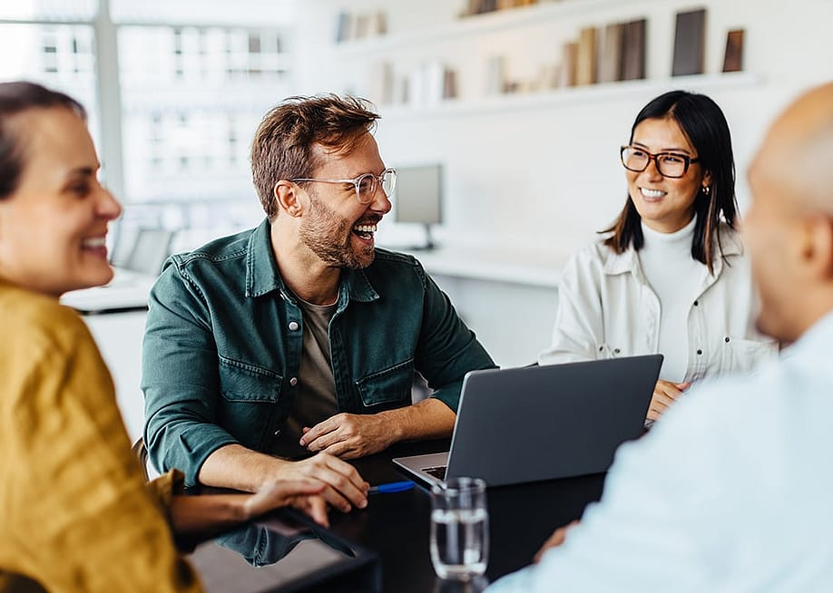 A business team having a meeting in an office. — JLco Julia Amaral // Shutterstock