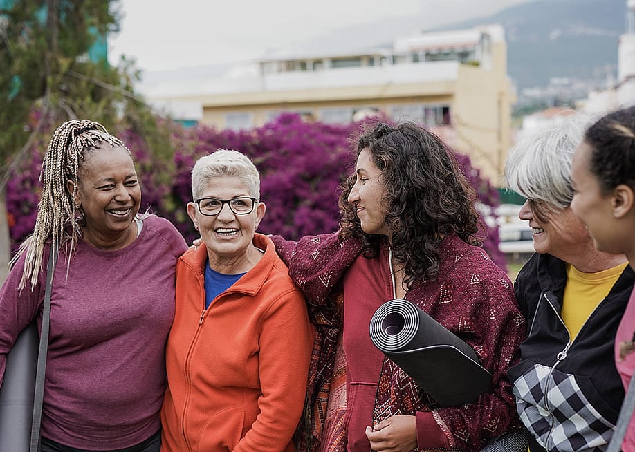 A group of four multigenerational women after a yoga class. — Sabrina Bracher // Shutterstock