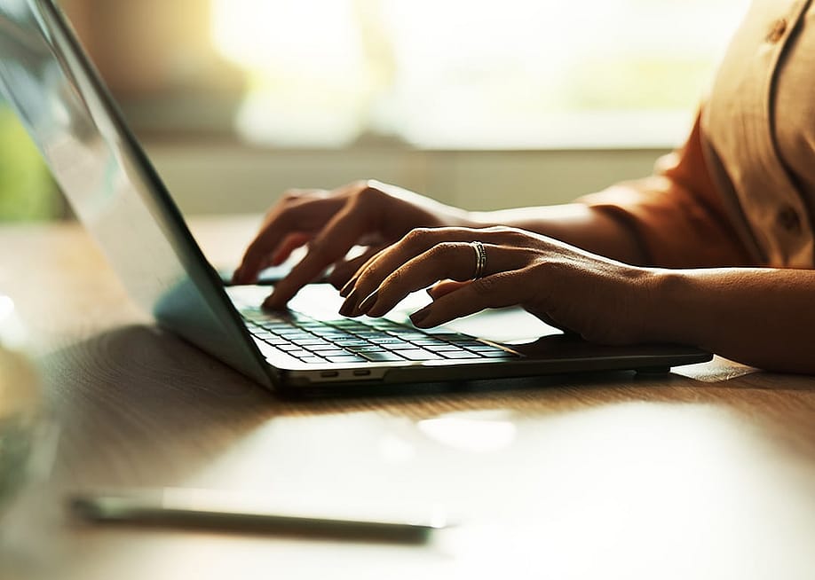 Freelancer typing on a laptop keyboard. — PeopleImages // Shutterstock