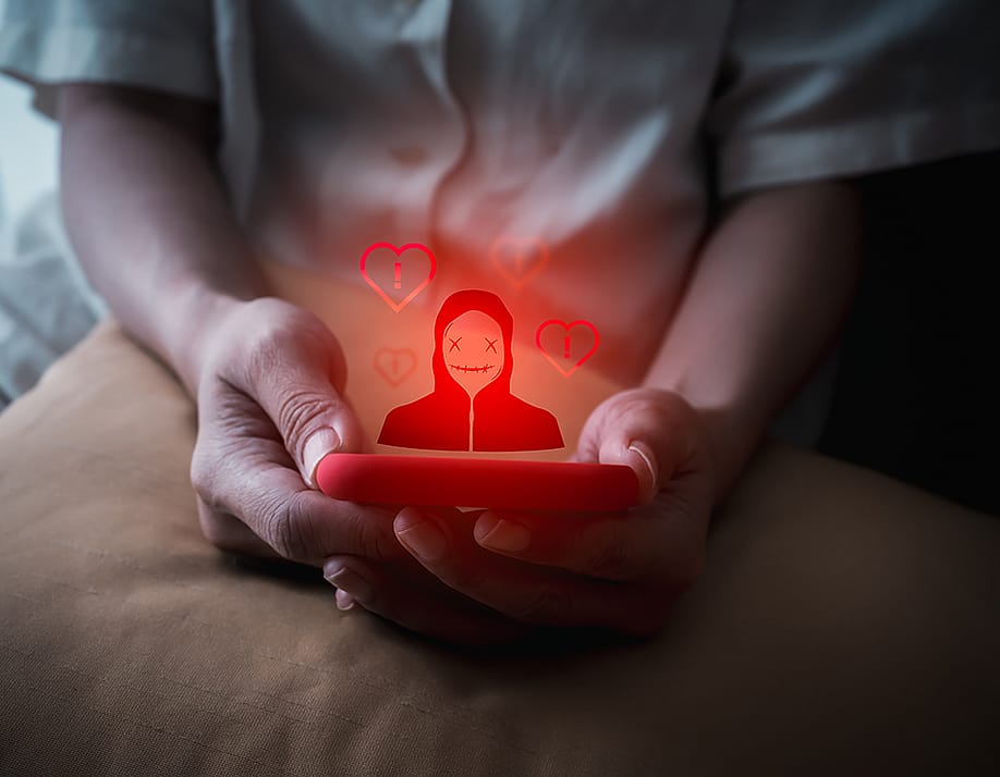 A person using a smartphone illustrated with a red anonymous identity graphics. — tete_escape // Shutterstock