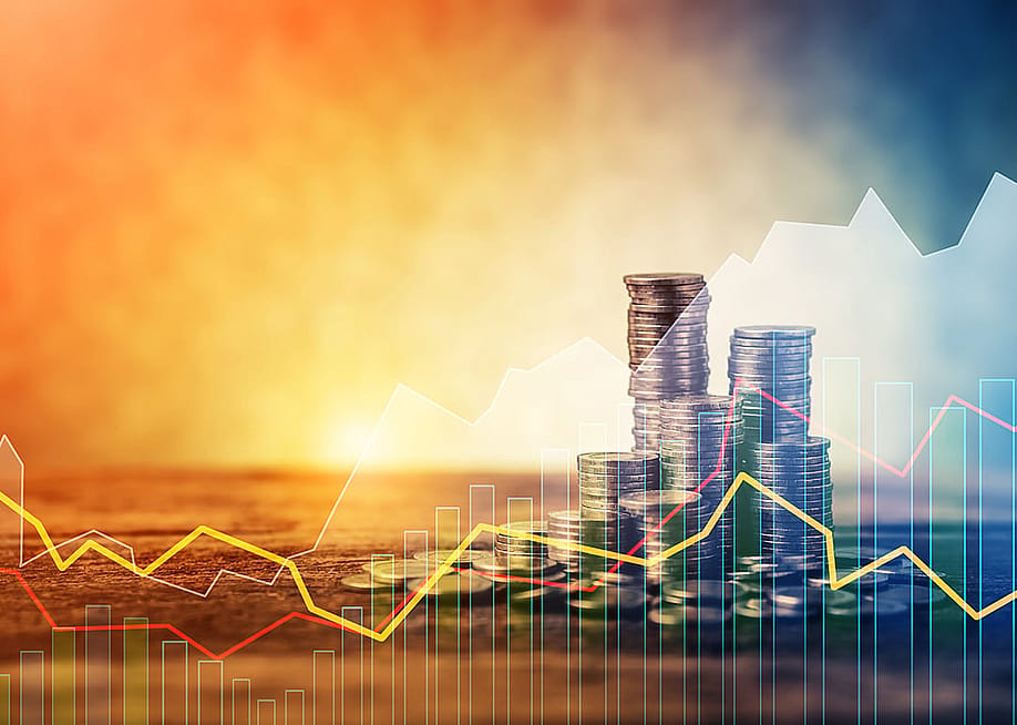 Stacks of coins with an overlay of steady stock trendline graphics. — WHYFRAME // Shutterstock