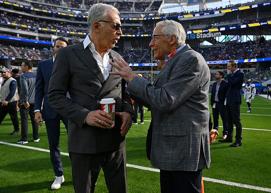 Stan Kroenke, owner of the Los Angeles Rams, talks with Rob Walton, owner of the Denver Broncos before a game at SoFi Stadium in Inglewood, California. — Jayne Kamin-Oncea // Getty Images