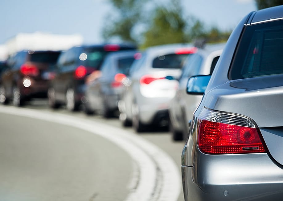 One side of the road with bumper-to-bumper traffic. — Christian Mueller // Shutterstock