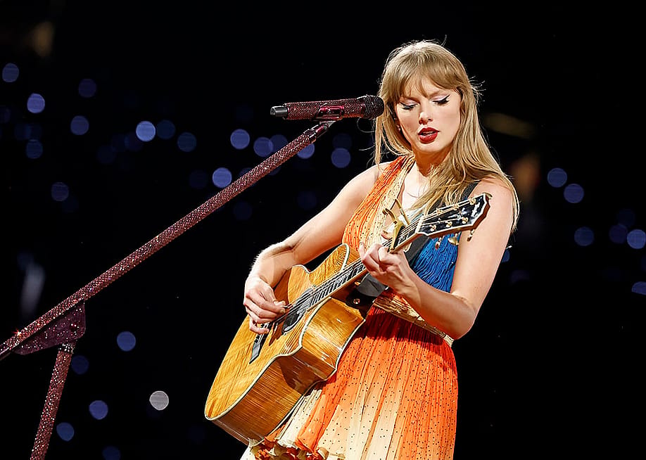 Taylor Swift performs on stage with her guitar during The Eras Tour at Rogers Centre in Toronto City, Ontario. — Photo by Emma McIntyre // TAS24 / Getty Images for TAS Rights Management
