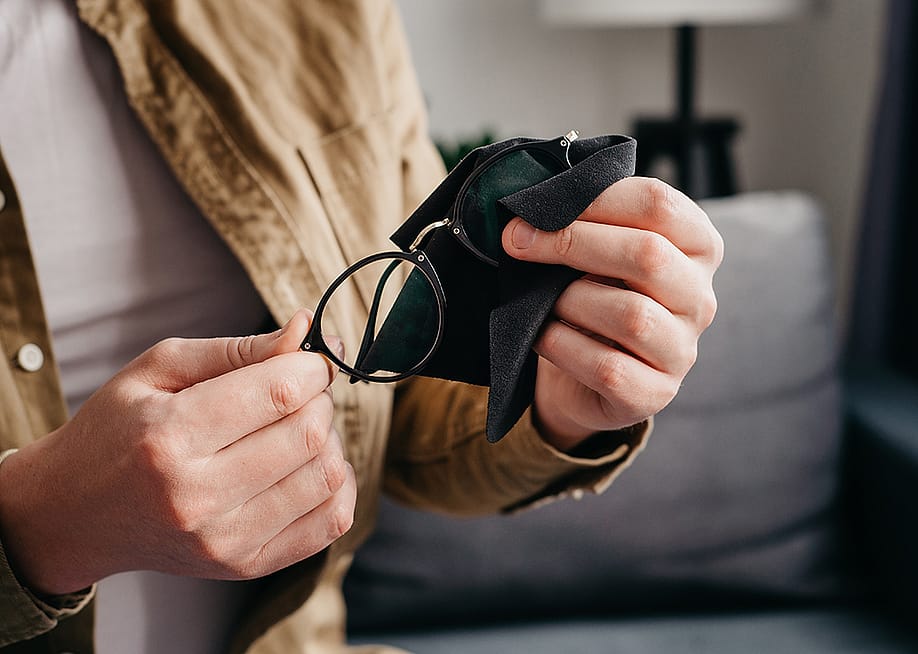 A pair of eyeglasses cleaned with a microfiber cloth. — Yurii_Yarema // Shutterstock