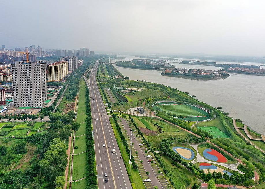 Aerial photo taken on July 31, 2021 shows a vegetation buffer belt at the Huangtaihu Lake water conservation scenic spot in Qian'an City of north China's Hebei Province, as an example of "sponge city construction." Following the principle of precipitation reserving, permeating and clarifying in natural ways, the local authority set out to build a city that "breathes." — Mu Yu // Xinhua via Getty Images