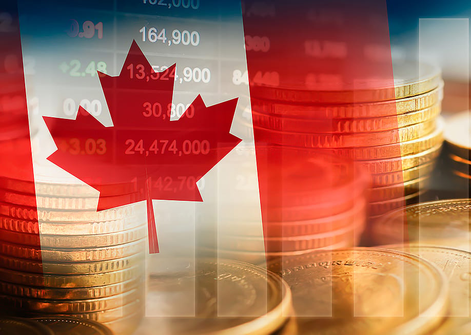 Canadian flag with an overlay of stock market graphics. — sweet_tomato // Shutterstock