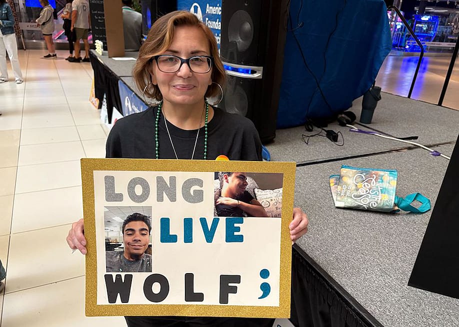 Jessie Edmond holds a photo of her son, Julian 'Wolf' Rivera, who died at 27 in 2019 in Middletown, New York. — Tim Henderson // Stateline