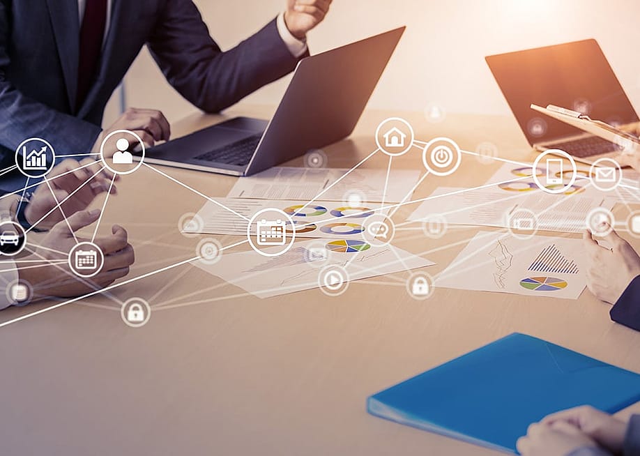Business people in a meeting with an overlay of networking and communication icons. — metamorworks // Shutterstock