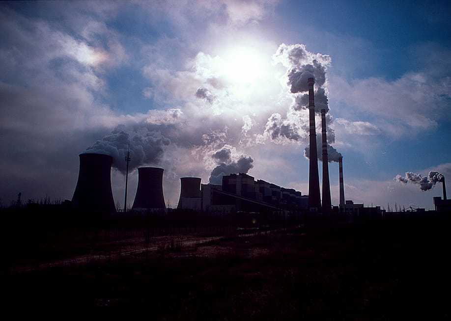 Silhouette of a coal-fired power plant spewing smoke into the air in Daqi, Inner Mongolia Autonomous Region, China. — Ryan Pyle // Corbis via Getty Images