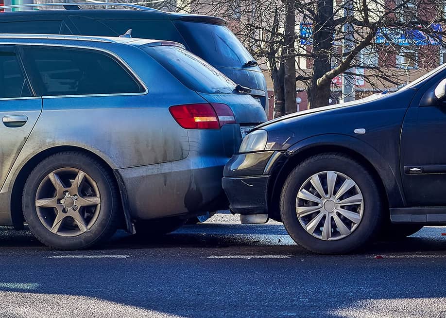 Two cars crashed on a street. — Siarhei Kuranets // Shutterstock