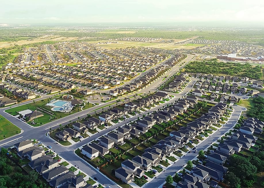 Aerial view of a masterplanned community of two-story houses in San Antonio, Texas. — Trong Nguyen // Shutterstock
