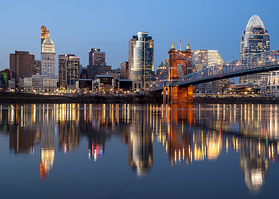 A view of Cincinnati over Ohio River during the evening. — Greg Widmeyer // Shutterstock