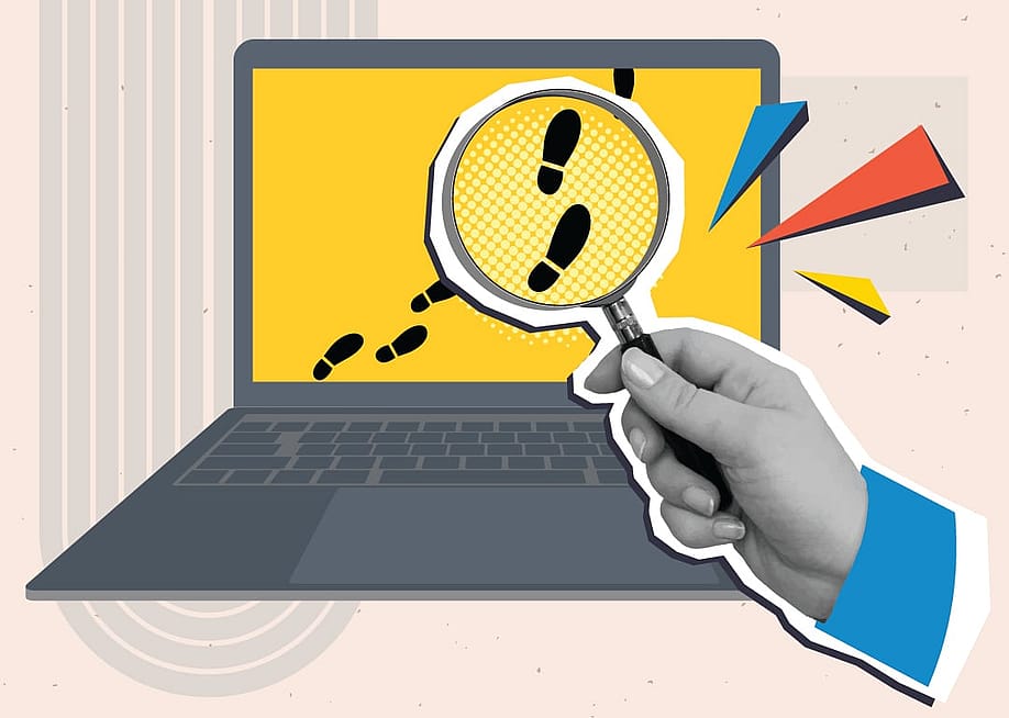 A collage style illustration of a hand holding a magnifying glass over digital footprints on a laptop screen. — Viktoriia_M // Shutterstock