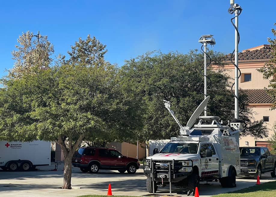 A T-Mobile SatCOLT or Satellite Cells on Light Truck parked on an American Red Cross lot. — T-Mobile
