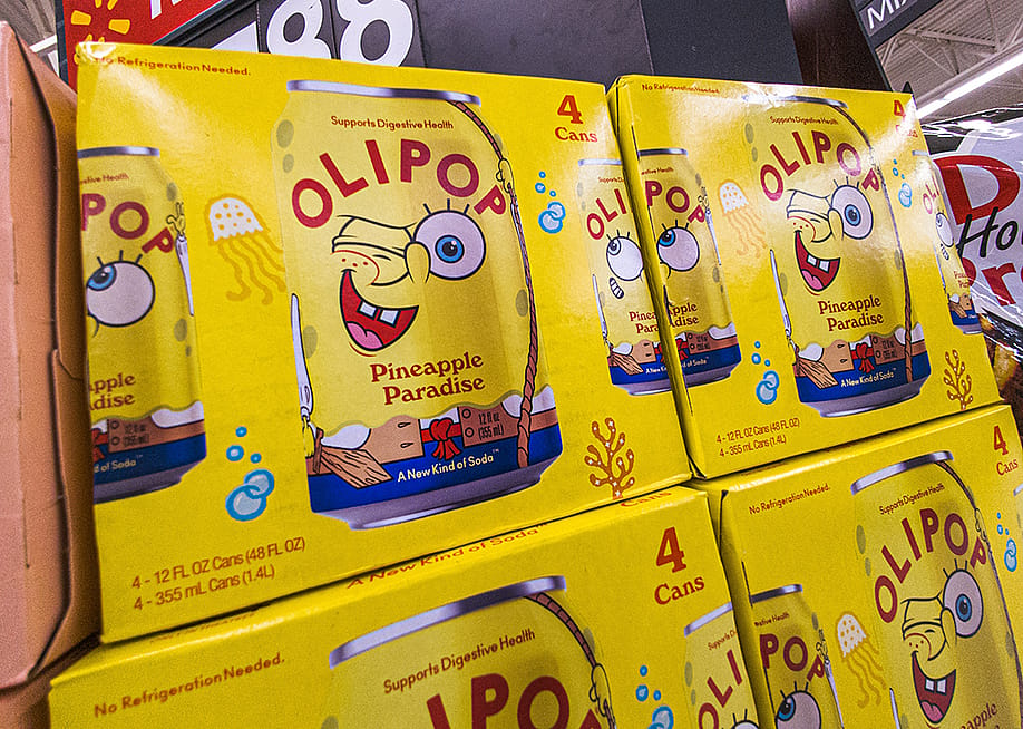Boxes of OLIPOP's collaboration probiotic drink with Spongebob Squarepants 'Pineapple Paradise' on display on a grocery store. — PJ McDonnell // Shutterstock