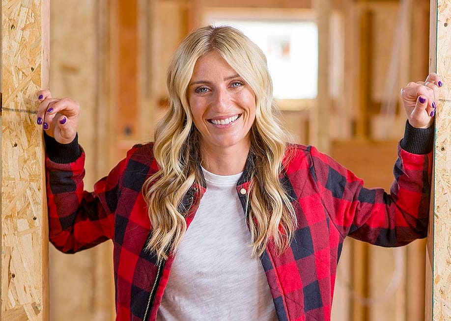 Jasmine Roth poses for a portrait inside a home renovation, wearing red and black buffalo check plaid. — Leonard Ortiz // Digital First Media / Orange County Register via Getty Images
