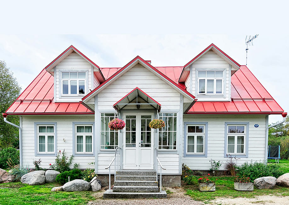 A large residential home with white and red exterior. — Dogar 96 // Shutterstock