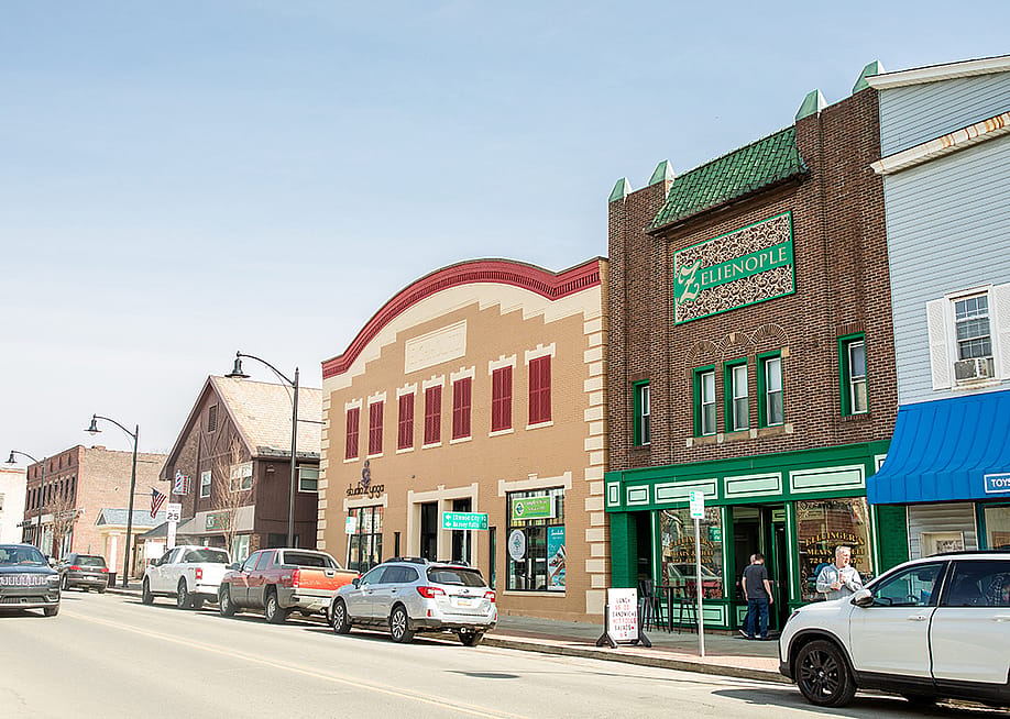 The main street in the borough of Zelienople in Pennsylvania on a sunny day. — Jenna Hidinger // Shutterstock