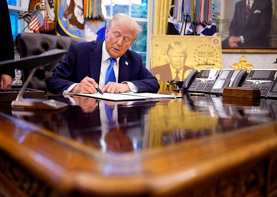 President Donald Trump signs an executive order in the Oval Office at the White House on September 19, 2025 in Washington, DC introducing a $100,000 fee for H-1B visas. — Andrew Harnik // Getty Images