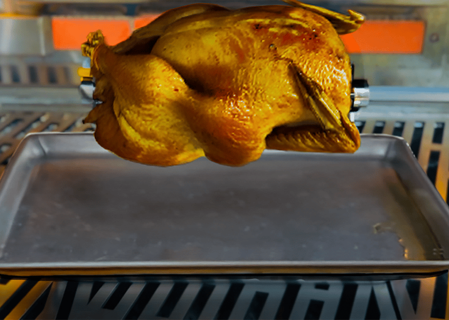 A turkey being on a rotisserie grill. — Wildfire Outdoor Living