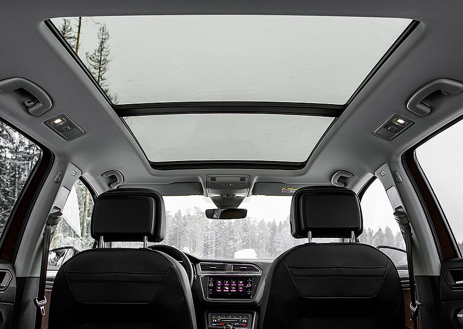 A backseat view of a panoramic roof of a car. — Roman Vyshnikov // Shutterstock