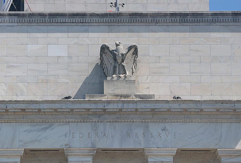 The Federal Reserve building with a figurine of the eagle above the doorway visible as it goes under construction on July 17, 2025 in Washington, DC. — Michael M. Santiago // Getty Images
