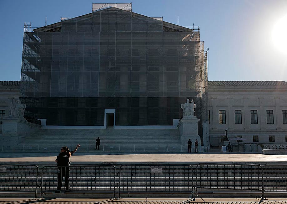 U.S. Supreme Court Police direct visitors from behind security barriers in front of court building, which is obscured in construction scaffolding, on the first day of the Court’s new term on October 06, 2025 in Washington, DC. — Chip Somodevilla // Getty Images