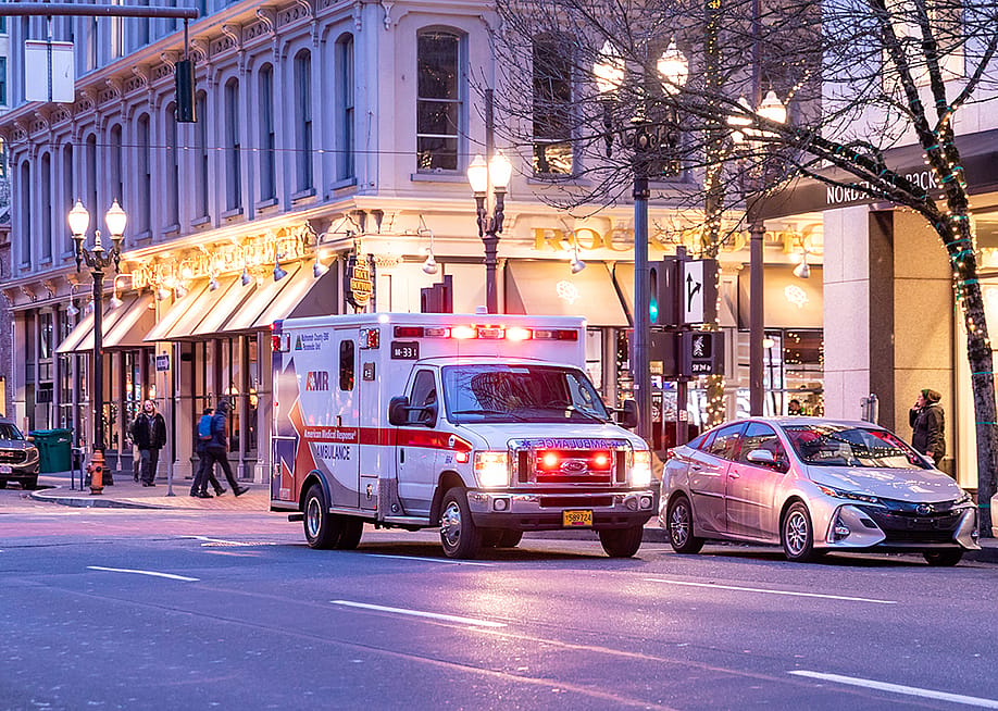An American Medical Responce ambulance unit in downtown Portland in Oregon. — Bandersnatch // Shutterstock