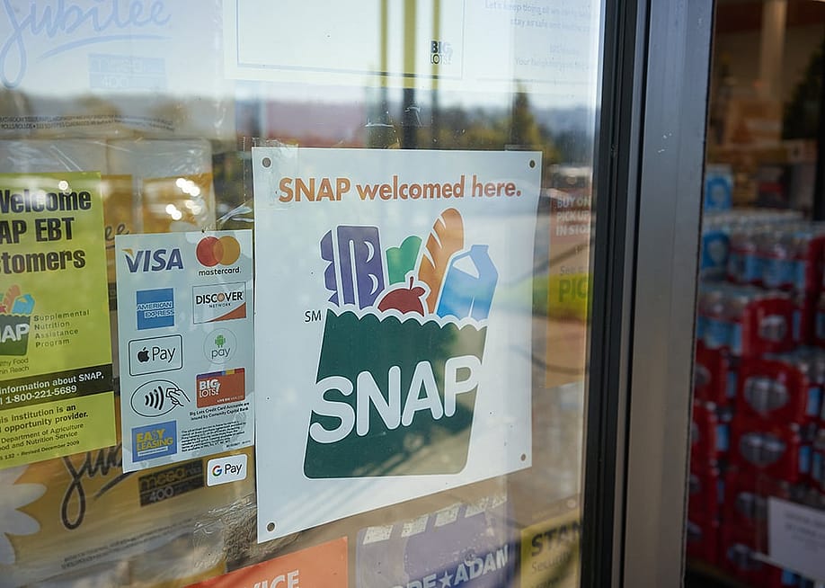 A 'SNAP welcomed here' sign at the entrance of a Big Lots store in Portland, Oregon. — Tada Images // Shutterstock