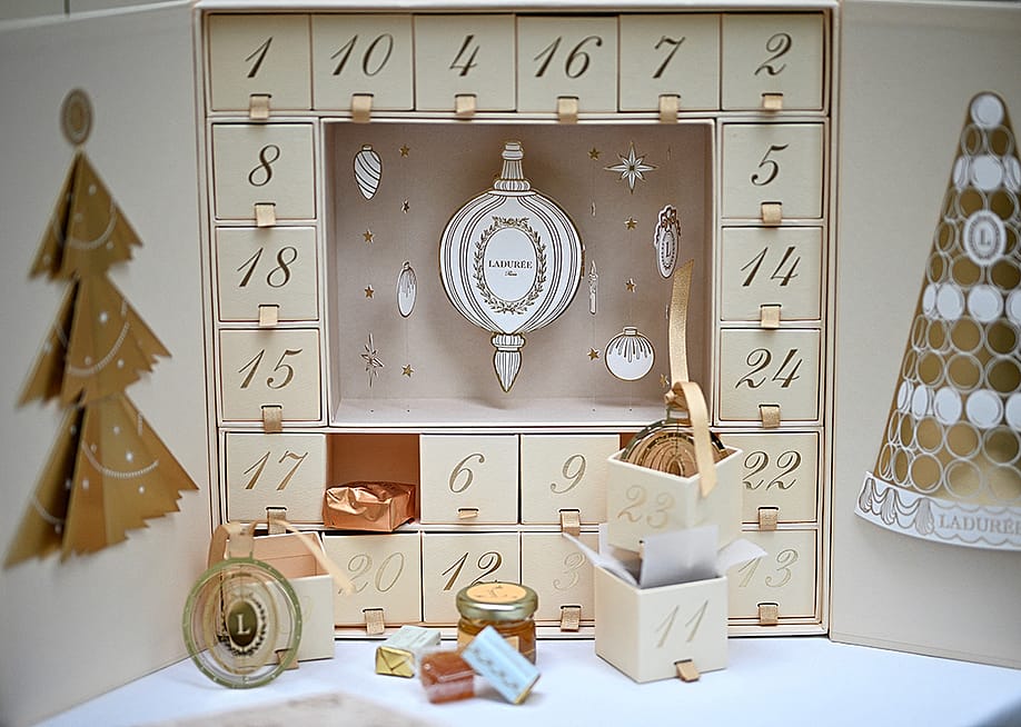 Ladurée gold Advent calendar displayed at their shop. — JULIEN DE ROSA // AFP via Getty Images
