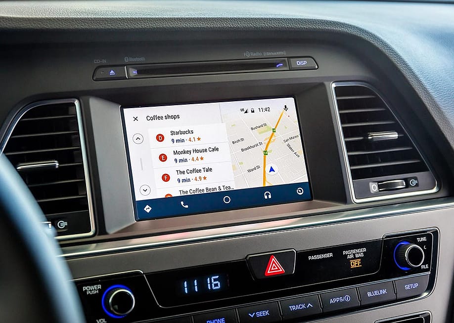 A 2017 Hyundai Sonata's dashboard displaying its GPS system and locations for nearby coffee shops. — Hyundai