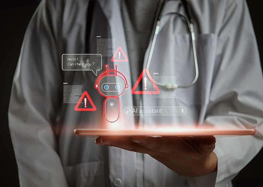 A doctor holding a tablet with AI chatbot and warning graphics illustrated. — khunkornStudio // Shutterstock