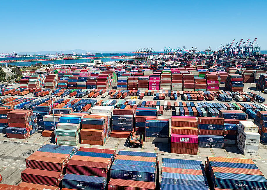 Stacked shipping containers in a port in Los Angeles, California. — Robert V Schwemmer // Shutterstock