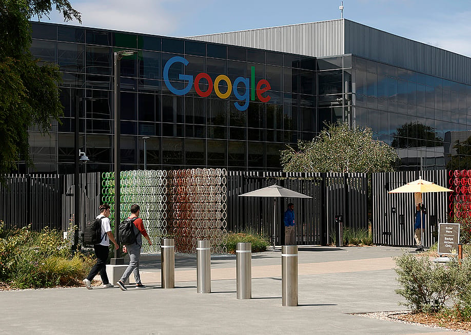 orkers enter a building on the Google headquarters campus in Mountain View, California. — Justin Sullivan // Getty Images