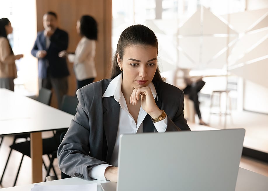 A young female professional working in a corporate office. — fizkes // Shutterstock