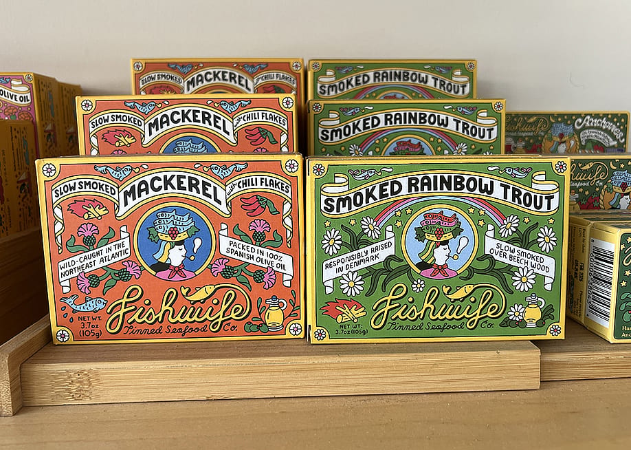 An assortment of Fishwife tinned seafood products on display. — Smith Collection // Gado / Getty Images