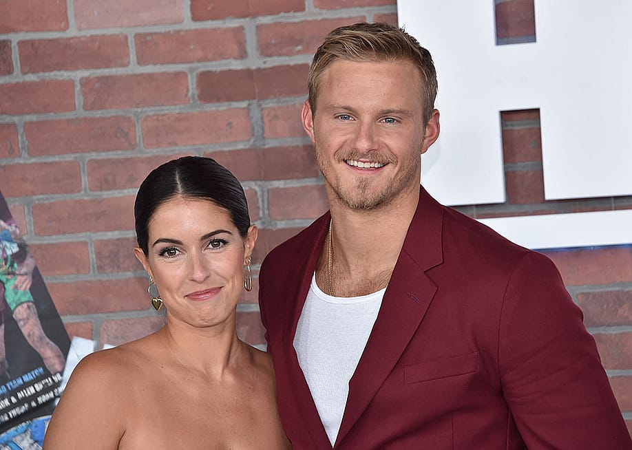 Actors Alexander Ludwig (R) and his wife Lauren Dear arrive for the premiere of "Heels" in Los Angeles on August 10, 2021. — CHRIS DELMAS // AFP via Getty Images