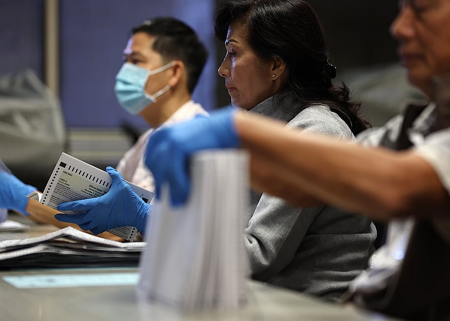 Election workers sorting mail-in ballots at the Santa Clara County registrar of voters office on October 21, 2024 in San Jose, California. — Justin Sullivan // Getty Images