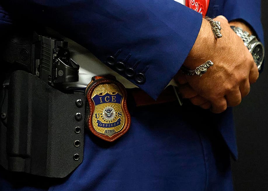 A detail view of the badge worn by deputy assistant director of field operations at ICE headquarters in Washington. U.S. Immigration and Customs Enforcement (ICE) major hiring event in Arlington, Texas. — Ron Jenkins // Getty Images