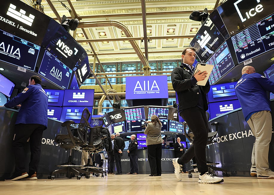 Traders work on the floor of the New York Stock Exchange during morning trading on November 19, 2025 in New York City. — Michael M. Santiago // Getty Images