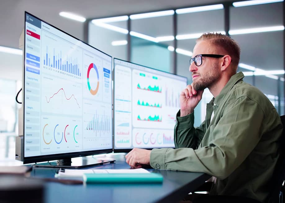 A data analyst reviewing dashboards. — Andrey_Popov // Shutterstock