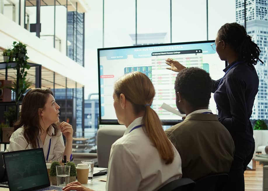 An accounting team reviewing budget and financial reports. — DC Studio // Shutterstoc