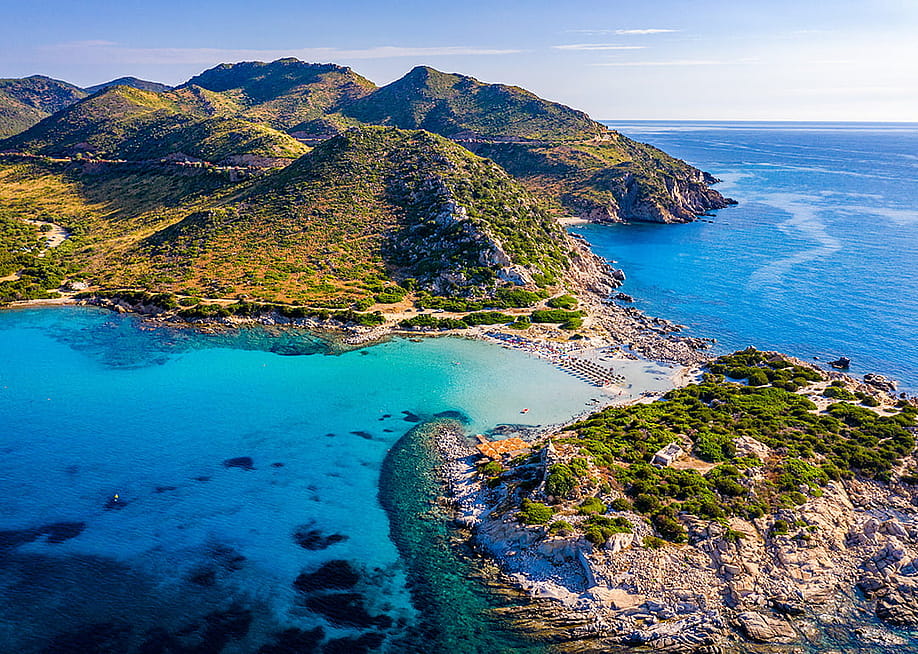 An aerial view of the beautiful beach at Punta Molentis, Villasimius in Sardinia, Italy. — DaLiu // Shutterstock