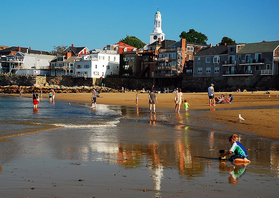 Families enjoying at the Front Beach in Rockport, Massachusetts. — James Kirkikis // Shutterstock