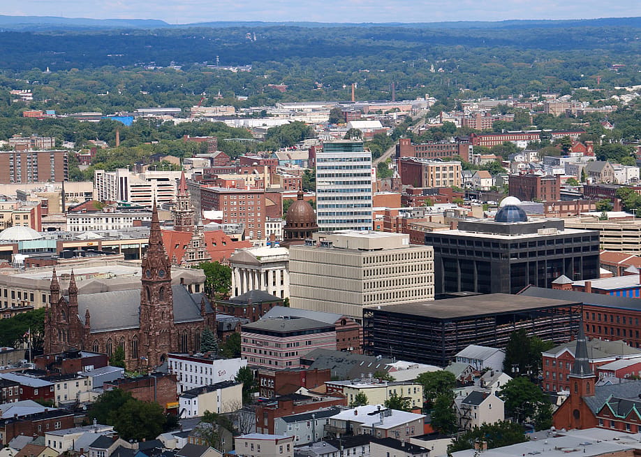 Cityscape view of downtown Paterson, New Jersey, from Garret Mountain Reservation. — quiggyt4 // Shutterstock