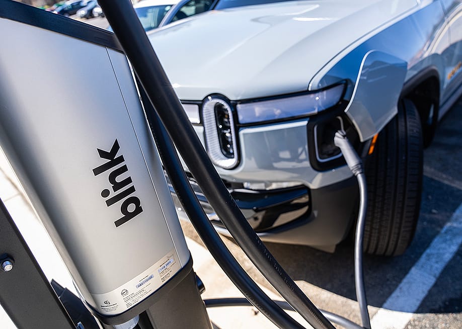 An EV charges from a Blink Charging station. — Tom Williams // CQ-Roll Call, Inc via Getty Images