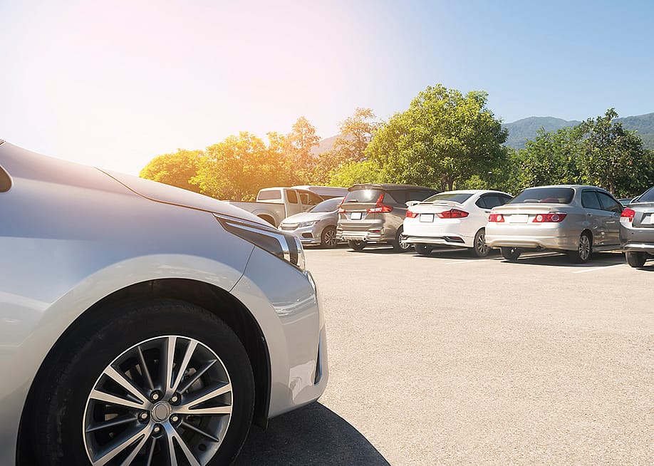 Parking lot with cars parked. — merrymuuu // Shutterstock