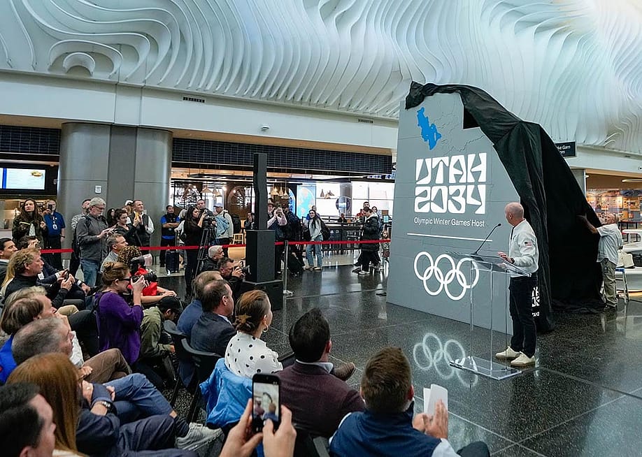 A crowd watches as organizers reveal a new name and logo — Utah 2034 — at Salt Lake City International Airport, as they count down les than 3,000 days until the Olympic Winter Games return to Utah. — Francisco Kjolseth // The Salt Lake Tribune